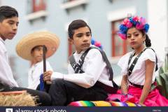 matamoros-tamaulipas-mexico-november-20-2018-the-november-20-parade-young-boy-wearing-traditional-mexican-clothing-holding-a-toy-rifle-during-t-RB0TX6